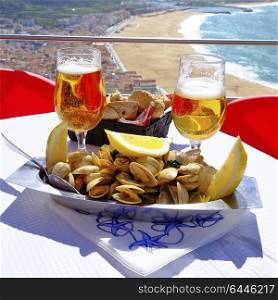 Summer lunch on the cliffs in picturesque Nazare Portugal.