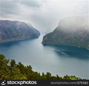 Summer misty overcast fiord vew from Stegastein Viewpoint (Aurland, Sogn og Fjordane, Norway)