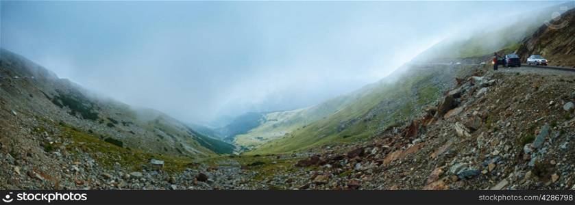 Summer misty view from Transalpina road (Southern Carpathians, Romania). Panorama.