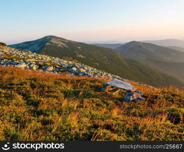 Summer morning Carpathian mountain top view from stony summit of Ihrovets Mount (Gorgany, Ukraine).