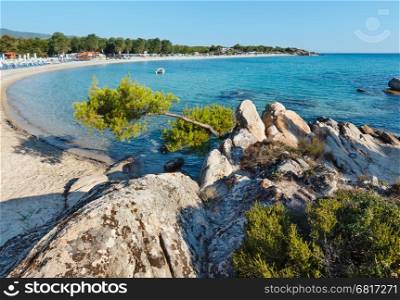 Summer morning Platanitsi beach on Sithonia Peninsula (Chalcidice, Greece). People are unrecognizable.