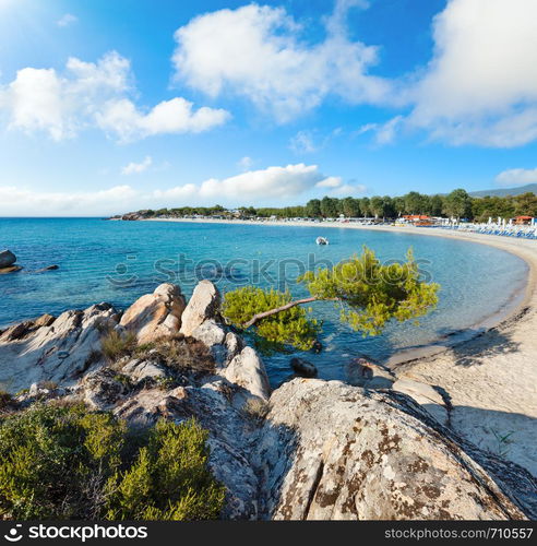 Summer morning Platanitsi beach on Sithonia Peninsula, Chalcidice, Greece. People are unrecognizable.