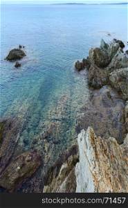Summer morning sea landscape, view from rocky shore nier Tristinika beach (Sithonia, Chalkidiki, Greece).