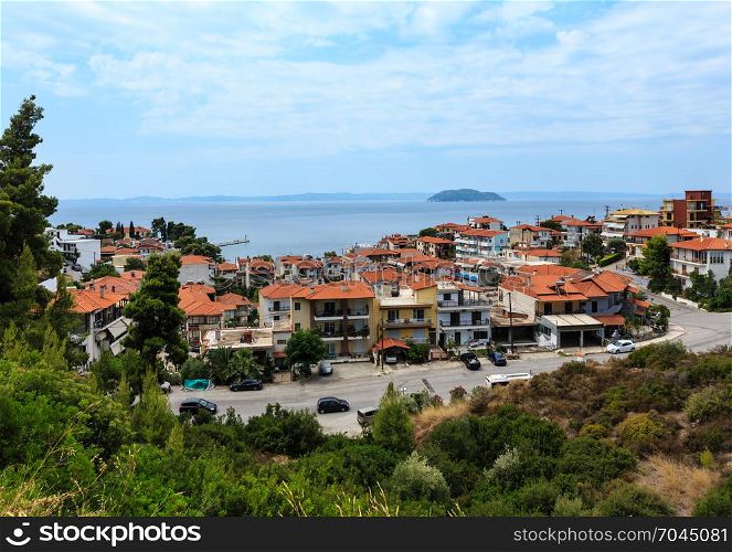 Summer morning top view on coastal Neos Marmaras village (Halkidiki, Sithonia, Greece).