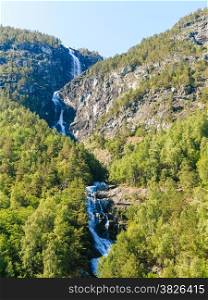 Summer mountain beautiful waterfall in Norway fjords Europe