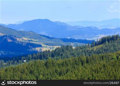 Summer mountain country landscape with fir forest on slope (Carpathian, Ukraine, Verkhovyna district, Ivano-Frankivsk region).