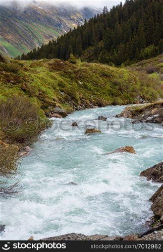 Summer mountain landscape with alpine river  Silvretta Alps, Austria .