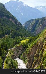 Summer mountain landscape with bridge across ravine (Alps, Switzerland)