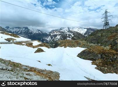 Summer mountain landscape with road and electric pole (Grimsel Pass, Switzerland)