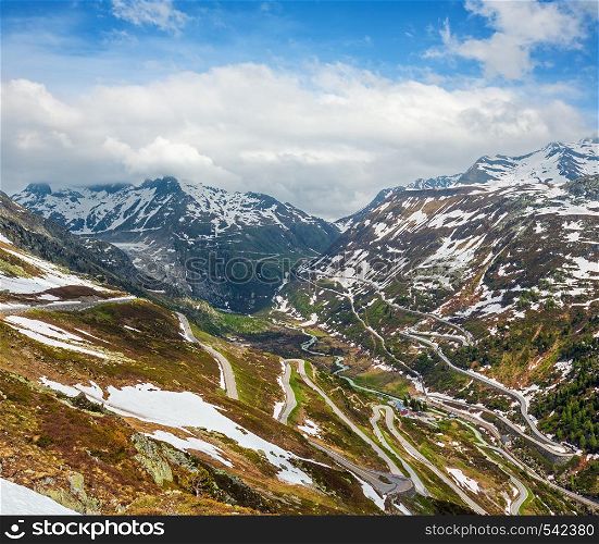 Summer mountain landscape with serpentine alpine roads, Grimsel Pass, Switzerland.