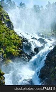 Summer mountain Latefossen (or Latefoss) waterfall on slope (Odda, Norway).
