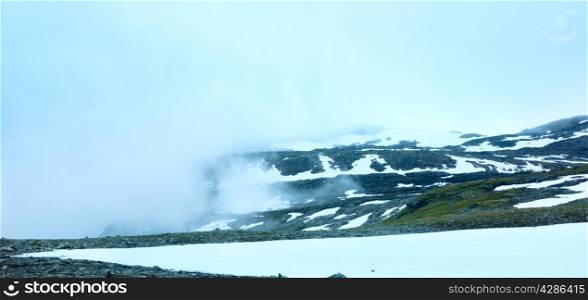 Summer mountain misty landscape with snow (Norway, Aurlandsfjellet).