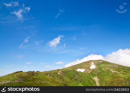 summer mountain ridge and snow on mountainside(Ukraine, Chornogora Ridge, Carpathian Mountains)