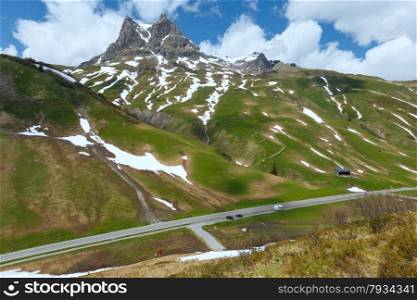 Summer mountain sunny landscape with snow on slope (Warth, Austria)