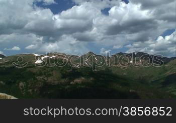 Summer Mountain Time-lapse Rain Storm Clouds. Great for themes of nature, wilderness, seasons, weather, summer, storms, travel, destinations, backgrounds, landscapes, environment, adventure, exploration, leadership, success, outdoor sports.