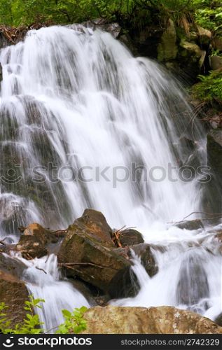 Summer mountain waterfall