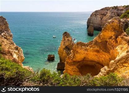 Summer ocean with rocky cliffs in sunny day, Portugal. Ocean with rocky cliffs