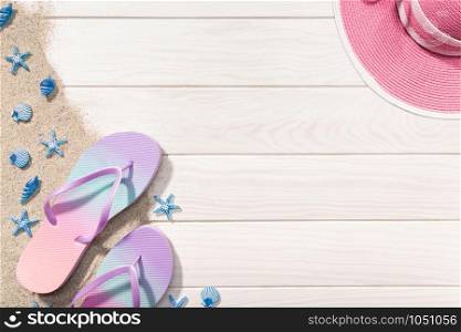 Summer or vacation concept. White Wooden background with flip flops, sand and seashells. Copy space
