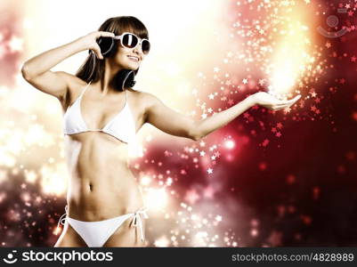 Summer party. Young pretty girl in white bikini and headphones