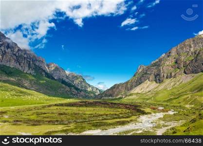 Summer picturesque landscape with Russian Caucasus rockies mountains and blue sky