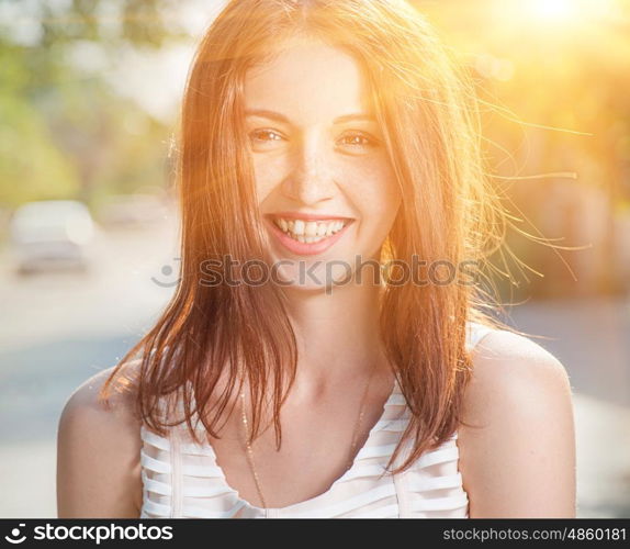 Summer portrait of a happy girl full of sunshine.