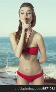 summer portrait of funny sexy girl posing with red bikini and long hair. Perfect body