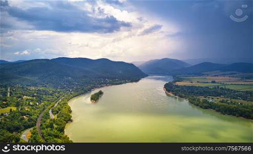 Summer rain and stormy weather. Danube river valley panorama. Aerial view of Danube river near Visegrad in Hungary