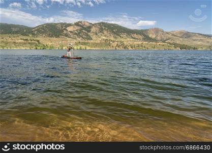 summer recreation on Horsetooth Reservoir in northern Colorado - paddling stand up paddleboard