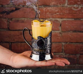 Summer refreshing orange cocktail with rosemary and fresh fruits