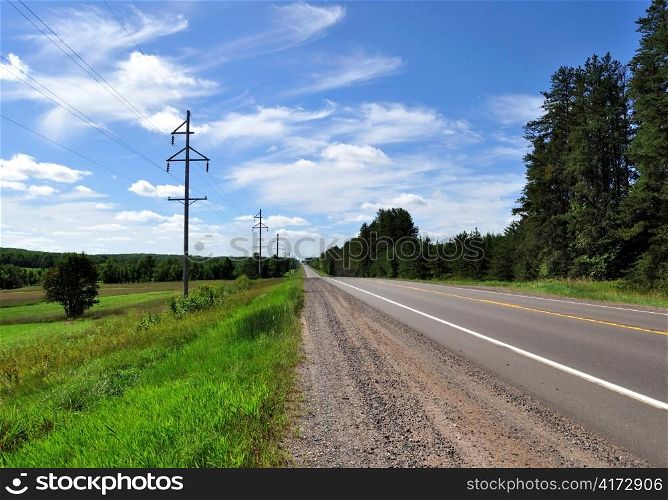summer road with sky and power line