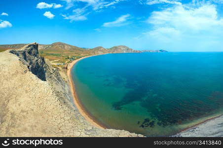 Summer rocky coastline and camping on sandy beach (Tihaja Bay, Crimea, Ukraine ). All peoples and cars is unrecognizable. Three shots stitch image.