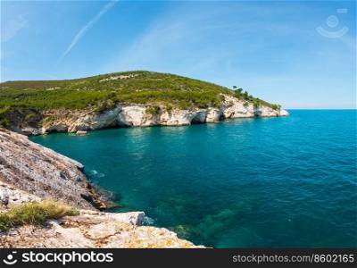 Summer rocky sea coast Baia Di C&i Vieste on the Gargano peninsula, Puglia, Italy