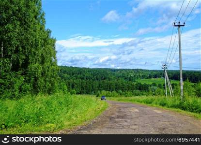 summer rural road leading to the village. summer rural road leading to the village, Russia