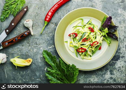 Summer salad of fresh zucchini, peppers and garlic.Vegetable salad. Zucchini vegetable salad