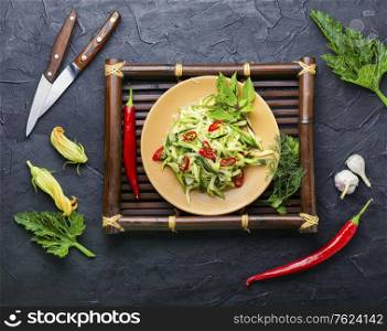 Summer salad of fresh zucchini, peppers, garlic and herbs.Vegetarian food. Zucchini vegetable salad