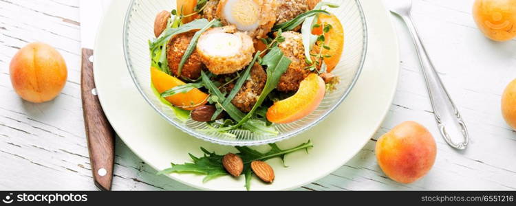 Summer salad with apricot, egg and greens.Healthy food. Summer salad with apricot