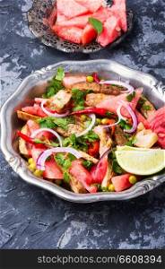 Summer salad with beef meat, watermelon and lime.Exotic food. Exotic salad with meat and watermelon