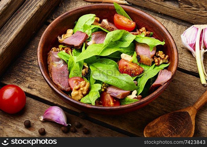 Summer salad with fresh herbs.Salad with spinach,bacon and sorrel. Spinach salad and sorrel