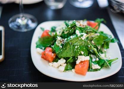 Summer salad with spinach,watermelon and goat cheese