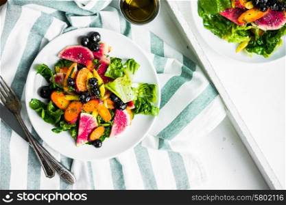 Summer salad with vegetables and berries