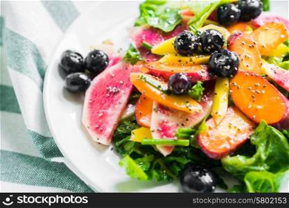 Summer salad with vegetables and berries