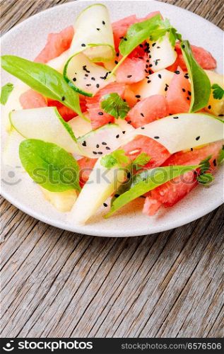 Summer salad with watermelon, cucumber and melon. Fruit salad. Salad with watermelon and melon