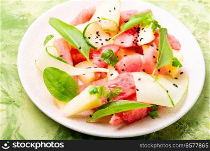 Summer salad with watermelon, cucumber and melon. Fruit salad. Salad with watermelon and melon