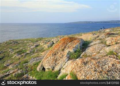 Summer sea and bike on stony coastline (Kazantip reserve, Crimea, Ukraine).