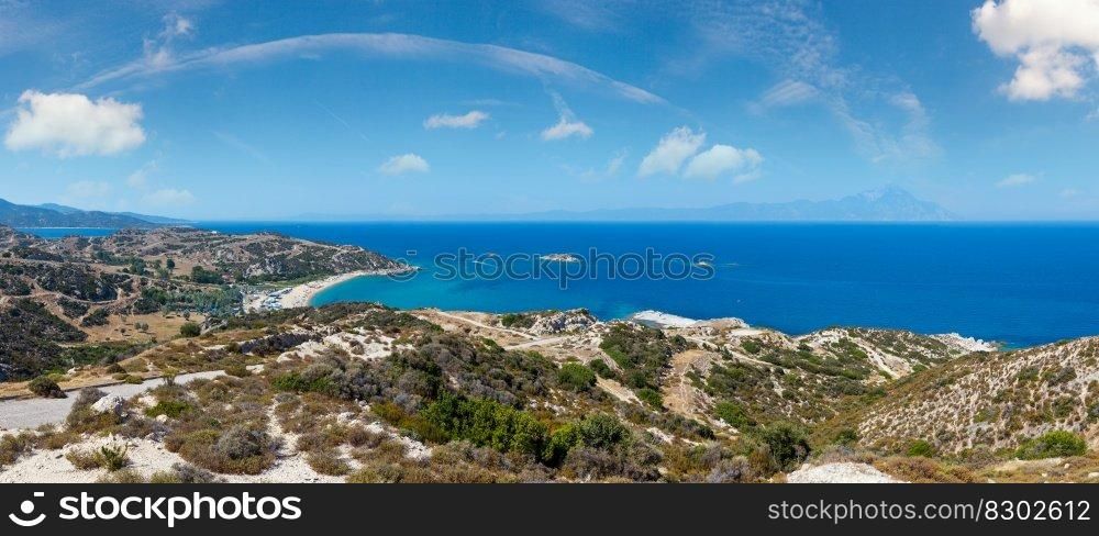 Summer sea coast landscape  Halkidiki, Sithonia, Greece . People are unrecognizable. Three shots stitch high-resolution panorama.