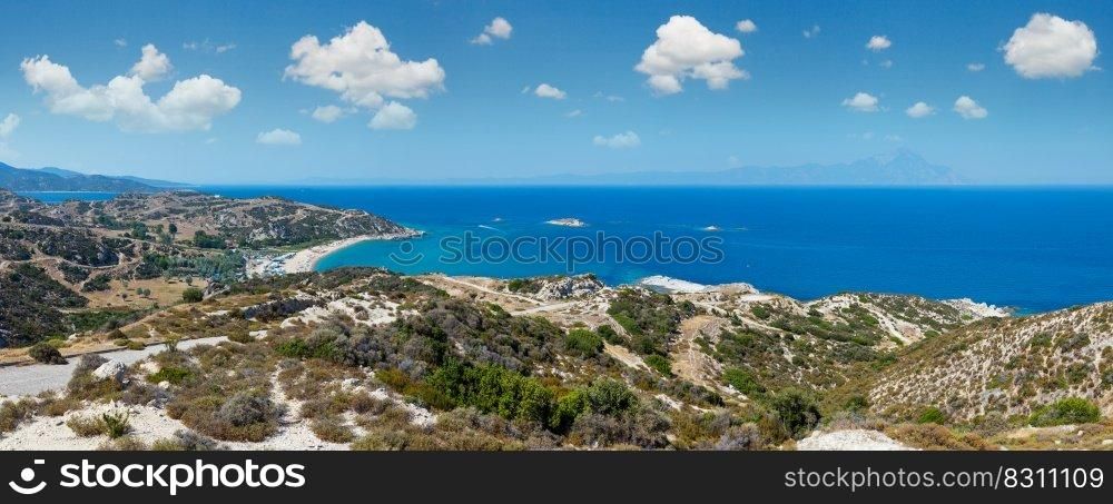 Summer sea coast landscape  Halkidiki, Sithonia, Greece . People are unrecognizable. Three shots stitch high-resolution panorama.