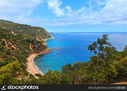 Summer sea rocky coast view with sandy Beach Cala del Senyor Ramon. Costa Brava, Catalonia, Spain.