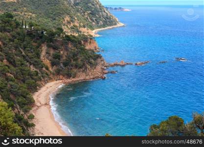 Summer sea rocky coast view with sandy Beach Cala del Senyor Ramon. Coasta Brava, Catalonia, Spain.