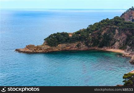 Summer sea rocky coast view with small sandy beach. Costa Brava, Catalonia, Spain.