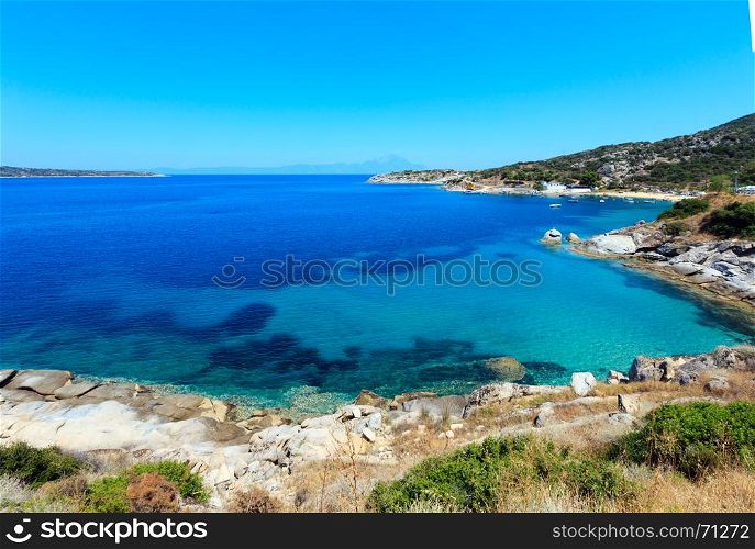 Summer sea scenery with aquamarine transparent water. View from shore (Sithonia, Halkidiki, Greece).